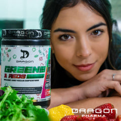 Dragon Pharma Greens and Reds scoop beside a vibrant smoothie bowl.