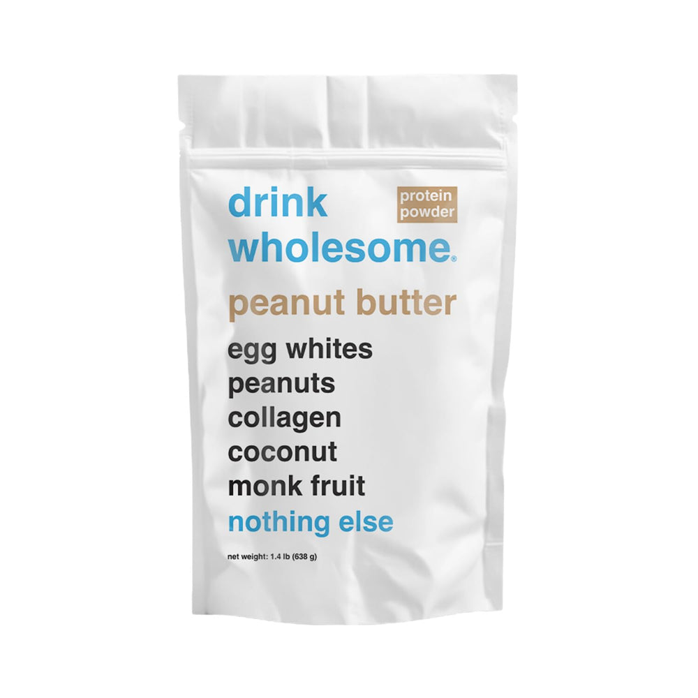 Drink Wholesome peanut butter egg white protein powder canister on counter for easy digestion.