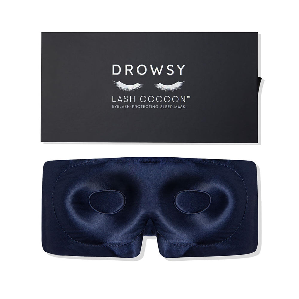 Drowsy eyelash-protecting silk sleep mask in midnight blue shields lashes gently.
