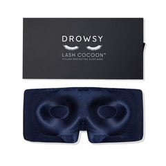 Drowsy eyelash-protecting silk sleep mask in midnight blue shields lashes gently.