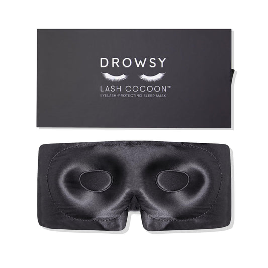 Drowsy eyelash protecting silk sleep mask with moonlight shadow design blocks light gently.