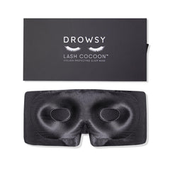 Drowsy eyelash protecting silk sleep mask with moonlight shadow design blocks light gently.