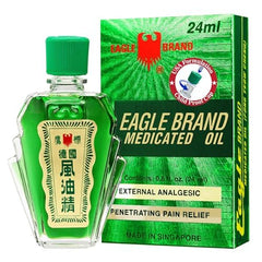 Eagle Brand green medicated oil bottle with refreshing aroma.