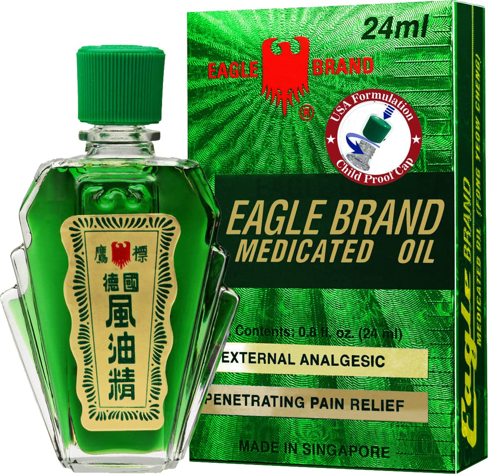 Eagle Brand medicated oil in a green bottle for soothing aroma.