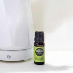 Edens Garden Mandarin-Green essential oil diffuser scene, highlighting citrus fragrance and uplifting ambiance.