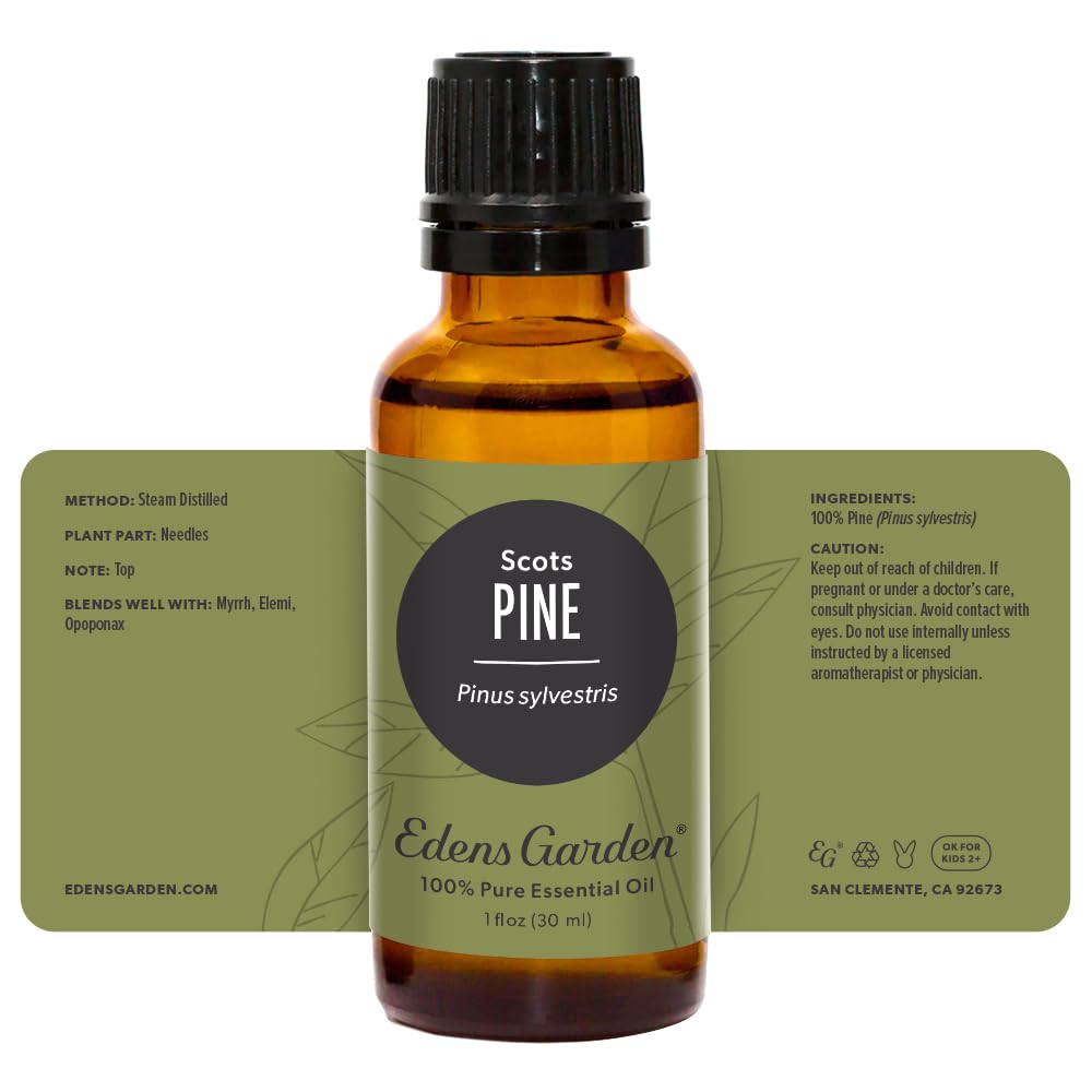 Edens Garden Pine-Scots oil near candle for cozy ambience