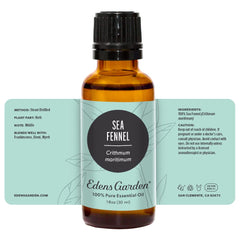 Edens Garden aromatherapy setup with diffuser and oil beside candles.