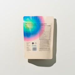 eimele Essential Rainbow being poured into a glass for steady energy.