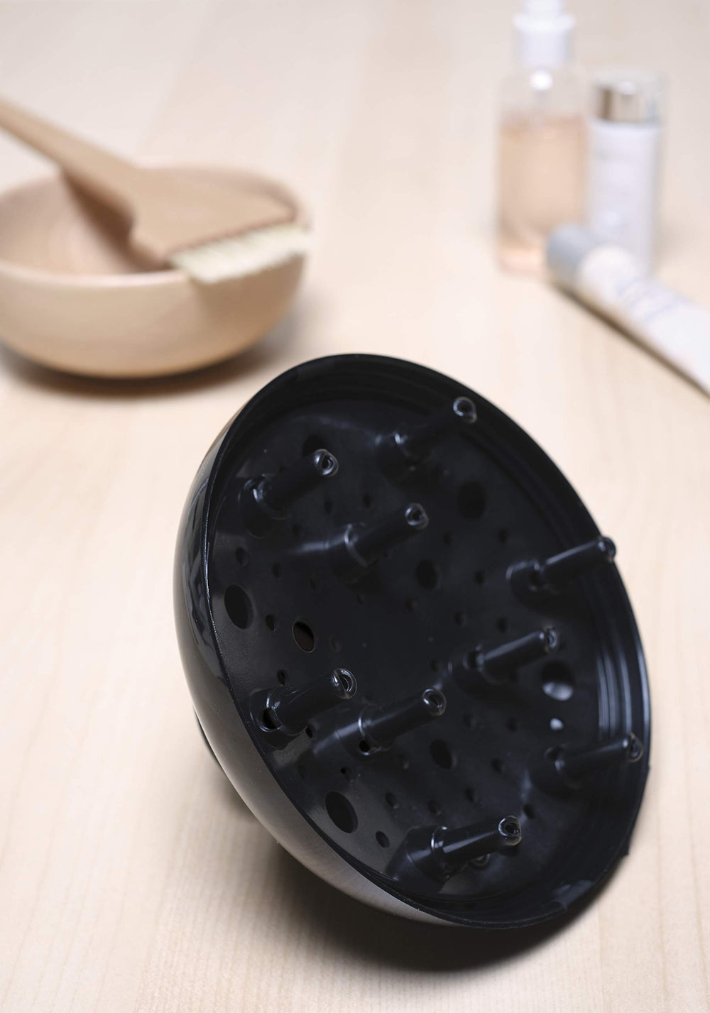 Elchim Cocoon diffuser in use with a dryer for volume control.