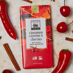 Endangered Species Chocolate bar cinnamon cayenne cherries served on a plate with dessert setup