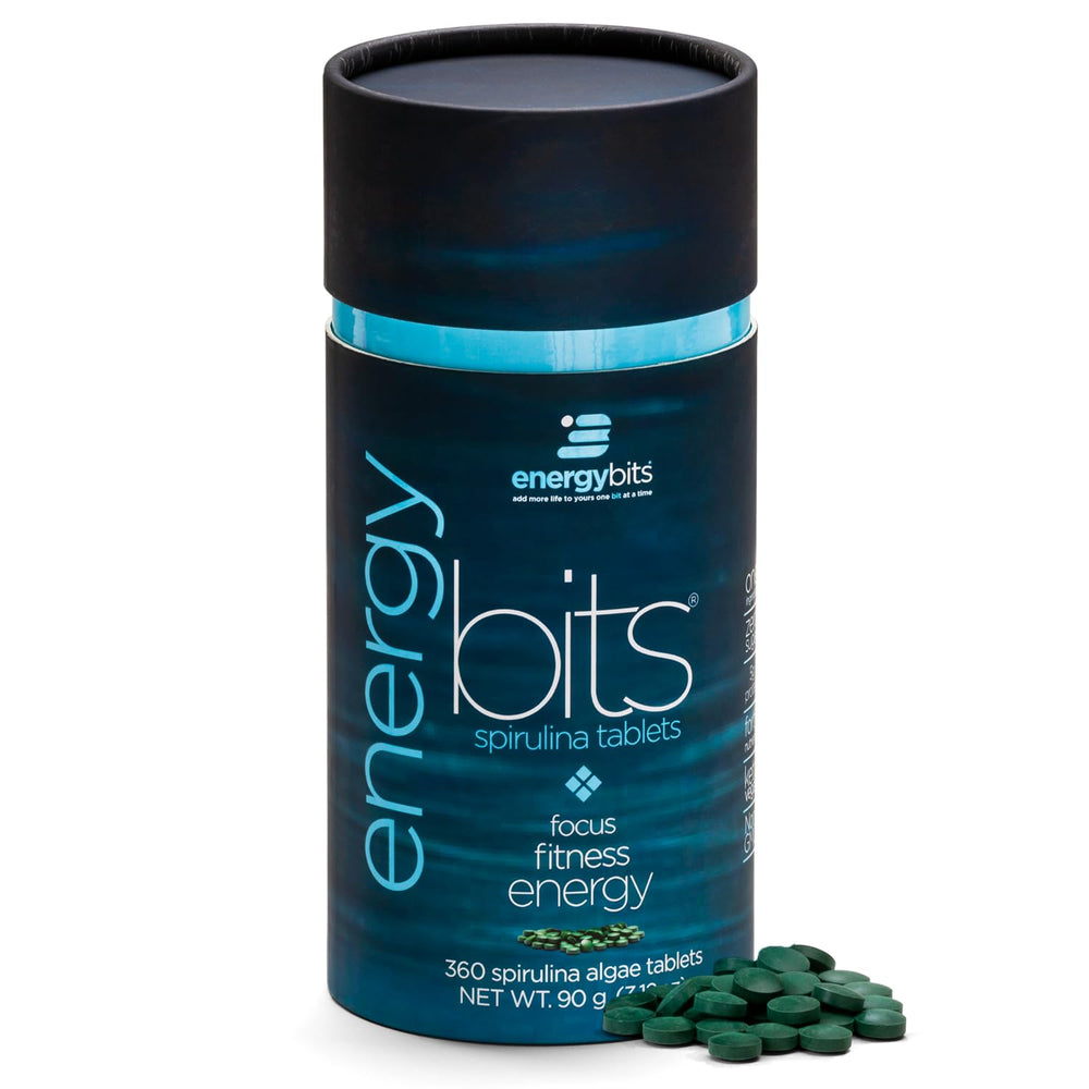ENERGYBITS spirulina tablet close-up showing a compact energy source for quick focus