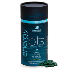 ENERGYBITS spirulina tablet close-up showing a compact energy source for quick focus