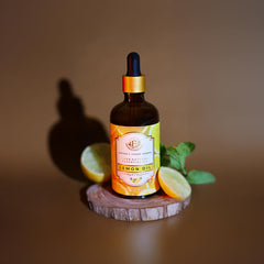Luxurious amber bottle featuring Enhanced Essentials lemon oil packaging.