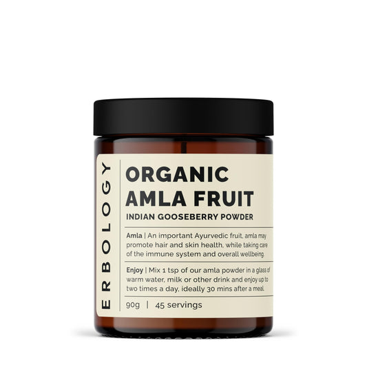 Erbology amla powder in amber jar, pure whole-fruit powder for daily skin vitality.