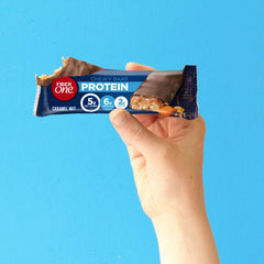 Fiber One caramel nut bar plated with breakfast items suggests quick, balanced morning nourishment