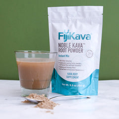 Serving FijiKava in a glass with coconut water and lime for flavor.