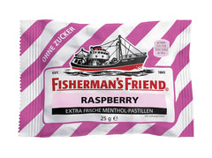 Close-up of Fisherman's Friend Raspberry Sugar Free lozenges in hand.