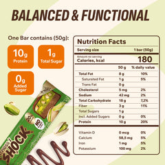 FitnesSHOCK bar unwrapped showing pistachio chunks for a protein-packed treat.