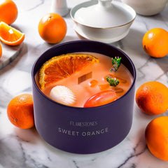 Flamestones Gemstone Woodwick Sweet Orange candle delivers bright citrus scent for uplifting spaces.