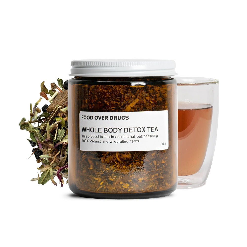 Food Over Drugs Whole Body Detox Tea packaging highlights organic herbs for daily balance.