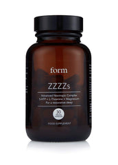 Form ZZZZs sleep bottle on a nightstand suggesting calm nights
