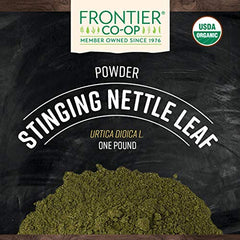 Frontier Co-op nettle leaf powder on a spoon, ideal for smoothies and blends.