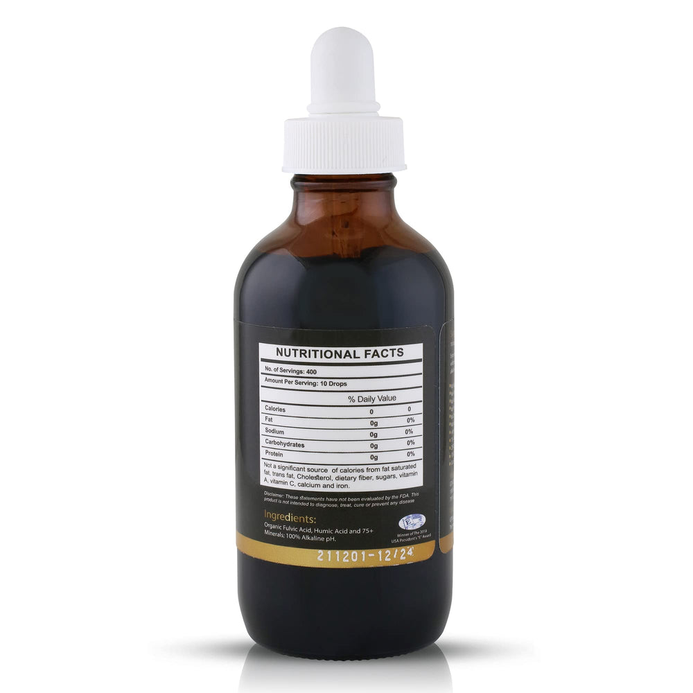 Glass of water with Fulvika Trace Mineral Drops suggesting alkaline hydration