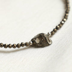 GEMPIRES NATURE’S TREASURE pyrite bracelet worn on the wrist in boho-minimalist style