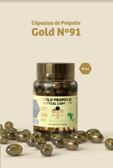 Close-up of 500 mg Bee Propolis Gold capsules in a bottle for daily use.