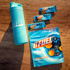 G Fuel Electrolytes Peach being stirred for quick hydration.