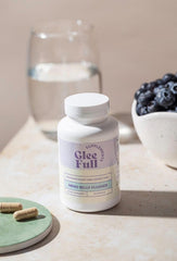 GLEEFULL SUPPS Meno Belly Flusher capsule scene emphasizing menopause-supportive gut wellness.