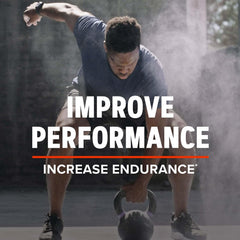 GNC AMP caffeine capsule close-up highlighting energy support for workouts.