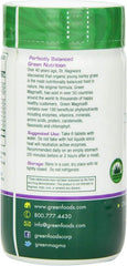 Green Foods Green Magma tablets in hand indicate convenient daily intake