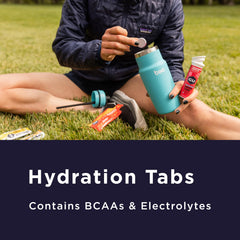 GU Energy Hydration effervescent tablets dissolving in water for convenient hydration.