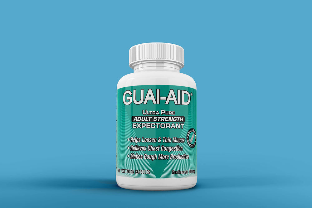 Close-up of GUAI-AID capsules inside the bottle for reference.