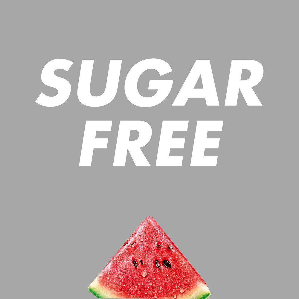 HALLS Minis Watermelon drops in mouth for quick use.