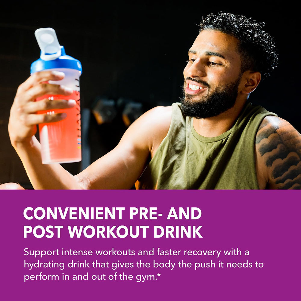 HAVASU L-Arginine mixed-berry powder stirred into a glass for a refreshing drink.