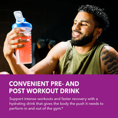 HAVASU L-Arginine mixed-berry powder stirred into a glass for a refreshing drink.