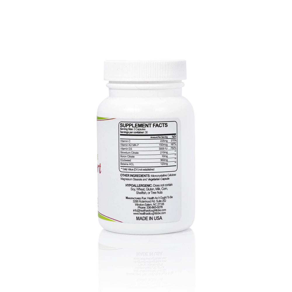 Health As It Ought To Be calcium-free bone support capsules close-up with natural ingredients.