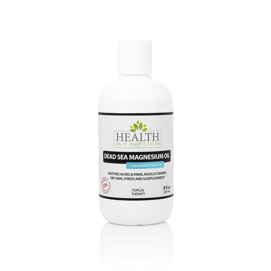 Health As It Ought To Be Dead Sea Magnesium Oil bottle on table promotes daily relaxation.