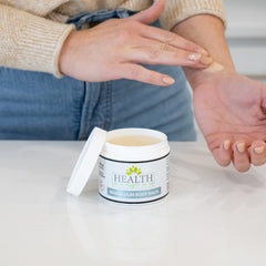 Health As It Ought To Be magnesium body balm jojoba coconut oil close-up shows creamy, hydrating formula.