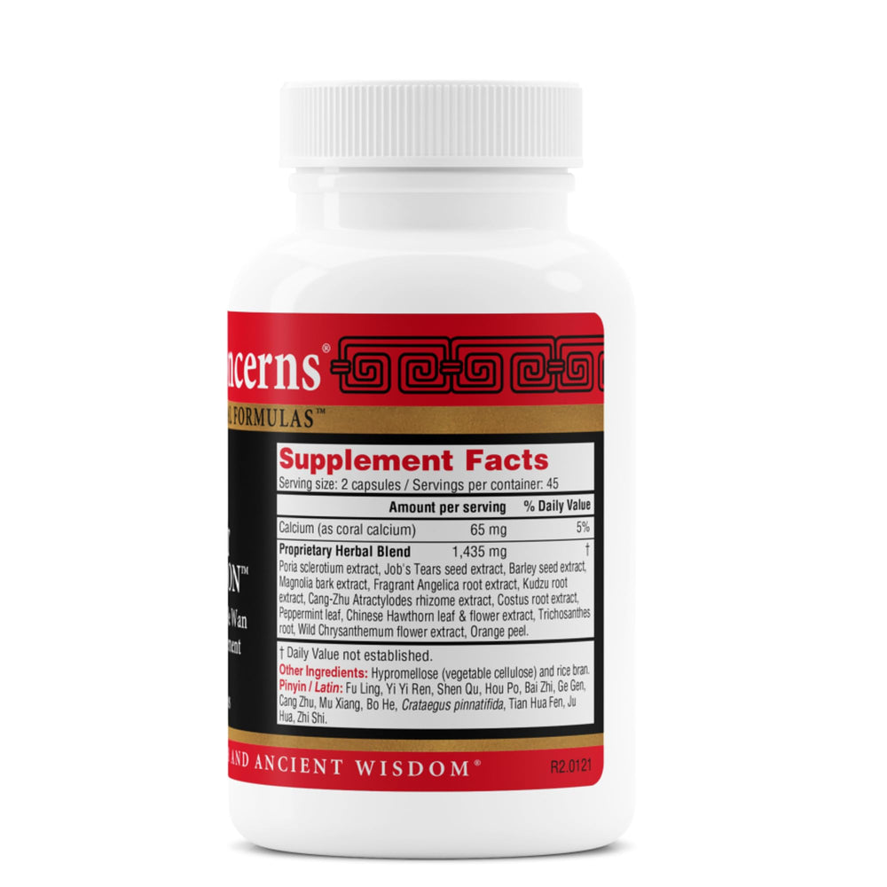 Health Concerns Quiet Digestion capsules in hand for after-meal daily digestive support.