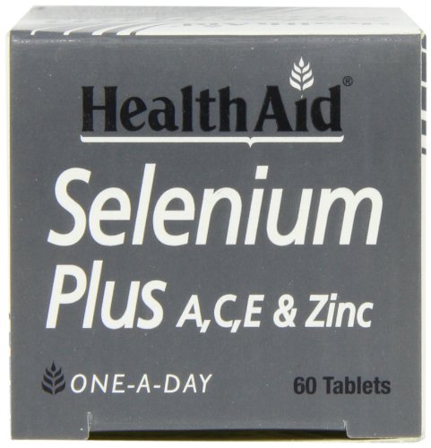 HealthAid Selenium Plus tablets on a counter with citrus suggests vitamin C synergy.