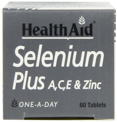HealthAid Selenium Plus tablets on a counter with citrus suggests vitamin C synergy.