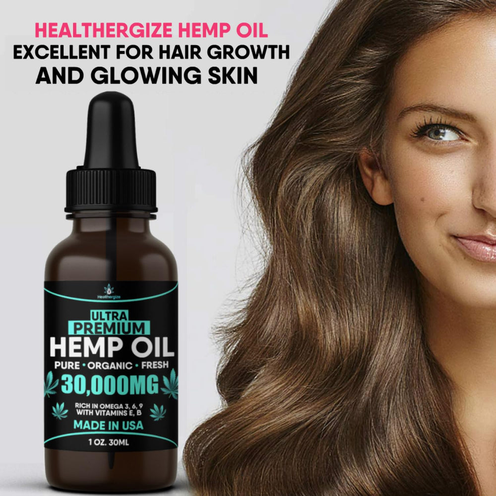 Healthergize hemp oil drops in palm for precise dosing.
