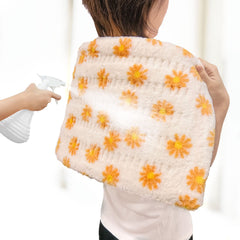 HELLOMOTO heating pad on bed used for relaxing sessions.
