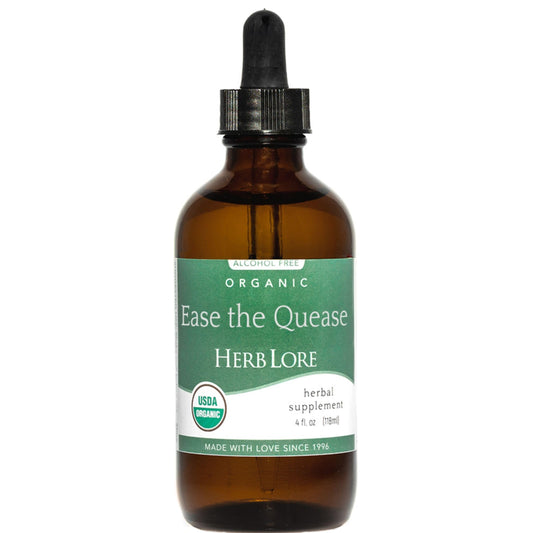 Herb Lore Ease The Quease bottle closeup showing organic ginger, peppermint, fennel for tummy comfort.