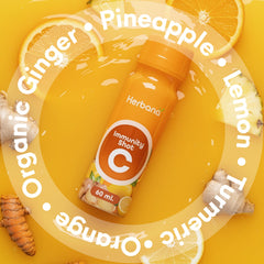 Herbana Wellness Shot bottle with ingredients background