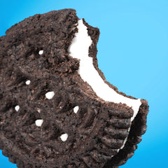 HighKey Keto Sandwich Cookies chocolate cream cross-section reveals rich cream between crisp chocolate cookies.