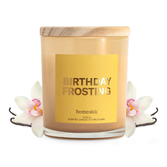 Homesick Birthday Frosting candle in a jar glows warmly for a cozy ambiance.